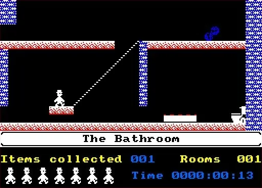 Jet Set Willy on the Amstrad CPC: Willy stands on a ledge in "The Bathroom" room, with items collected and elapsed time shown at the bottom